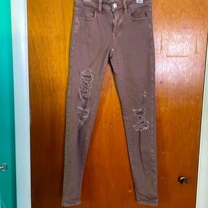American eagles jeans size 0. Color a lighter purple or mauve.